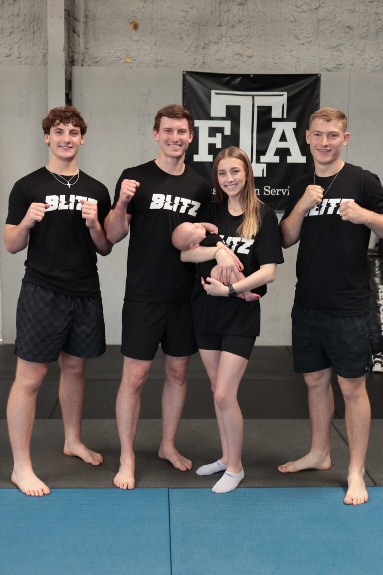 Blitz Martial Arts family, including Sensei Daygan and Tyce, as well as Brooklyn office admin and baby Zayd.