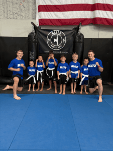 Sensei Tyce and Daygan with the Big Ninjas class after completing the belt test.