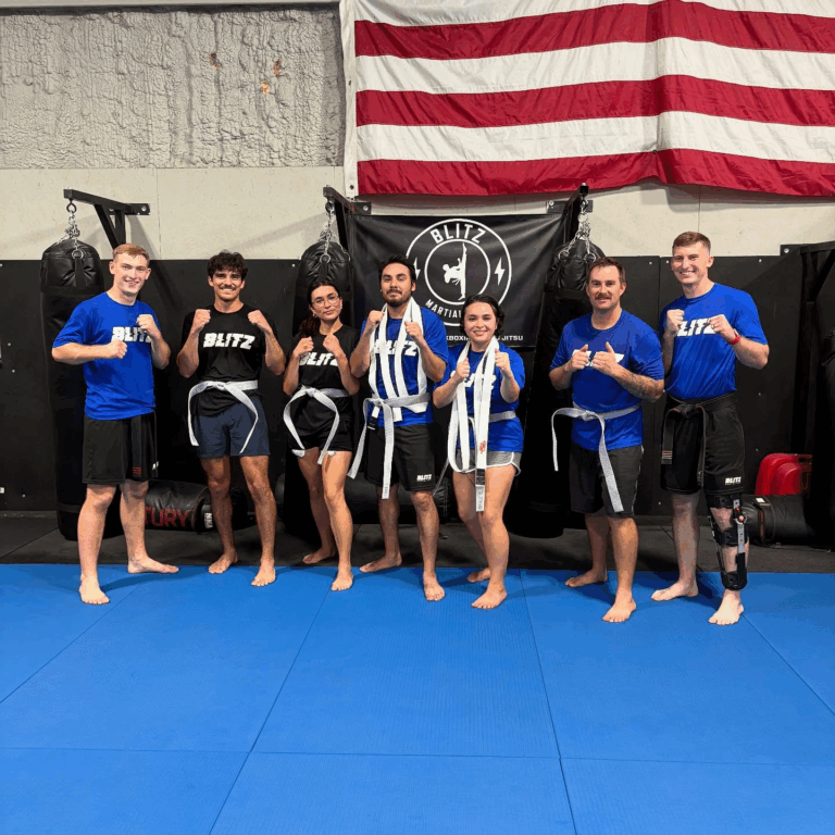 Sensei Daygan and Tyce with the adults mma class after the belt test.