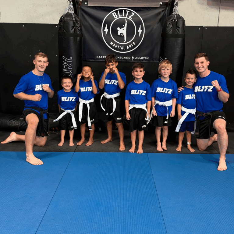 Sensei Daygan and Tyce Talbott with the Big Ninja and Kids class after the belt test.