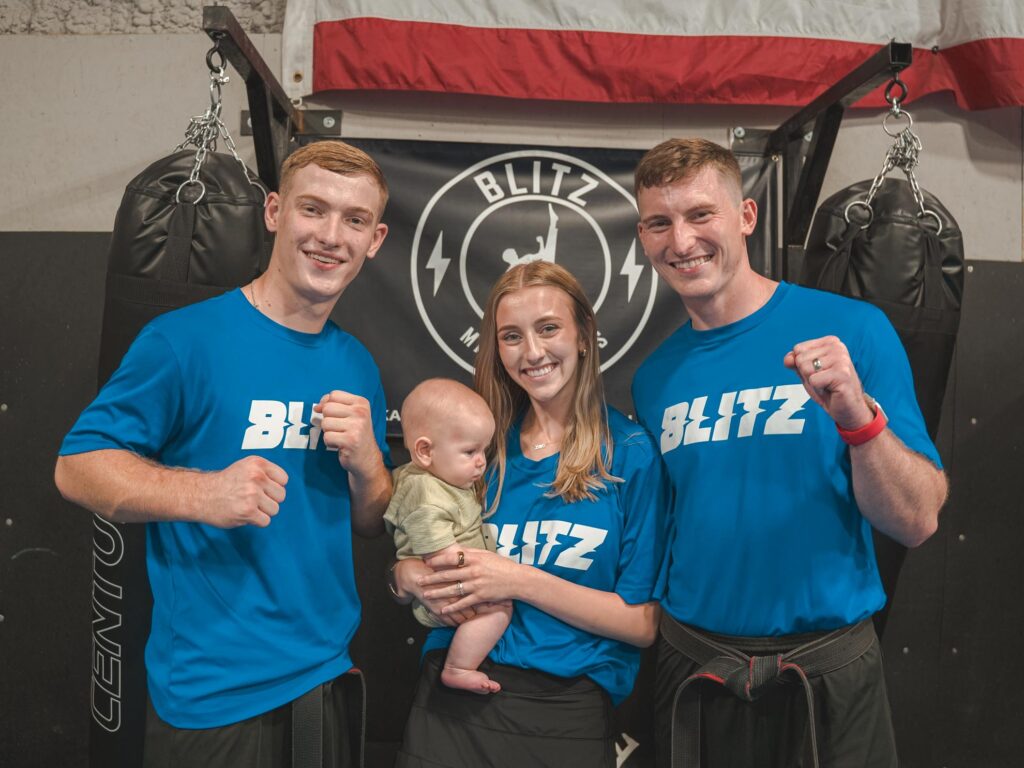 Blitz Martial Arts family, including Sensei Daygan and Tyce, as well as Brooklyn office admin and baby Zayd.