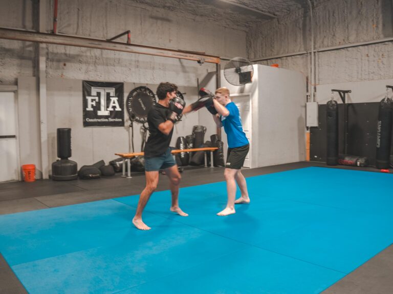 Sensei Daygan performing belt test with adult student.